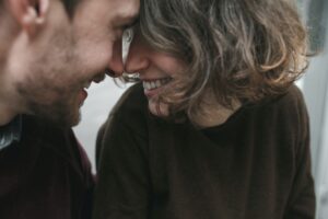 Vintage couple hugs and laughing .Coffee shop