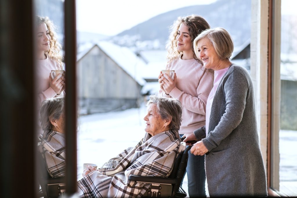 A teenage girl with mother and grandmother at home.